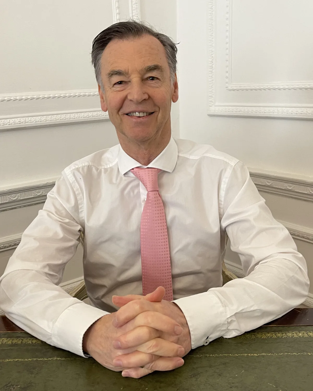 Dr Mike Tee at his desk